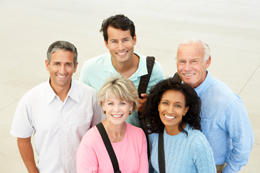 A group of people standing and smiling