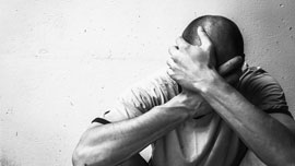 a man holding his head