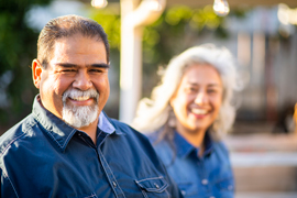 a man and a woman smiling