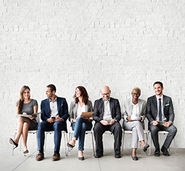 a grouple of people sitting on chairs