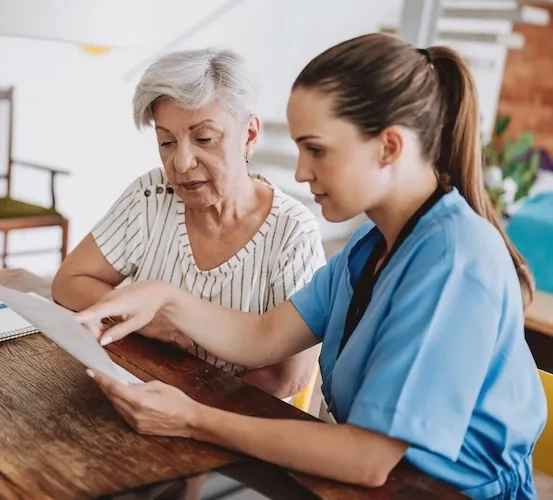 A healthcare professional speaking with a patient