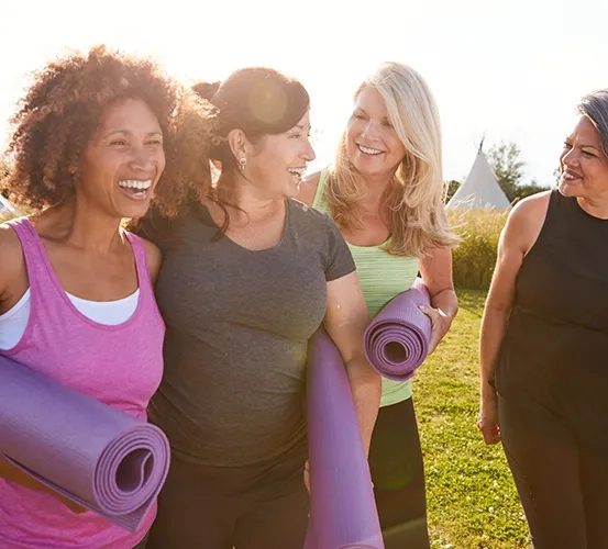 a group of women walking to yoga class