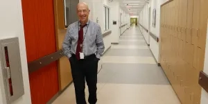 Dr. Gilman walking in Clinical Center E-Wing.